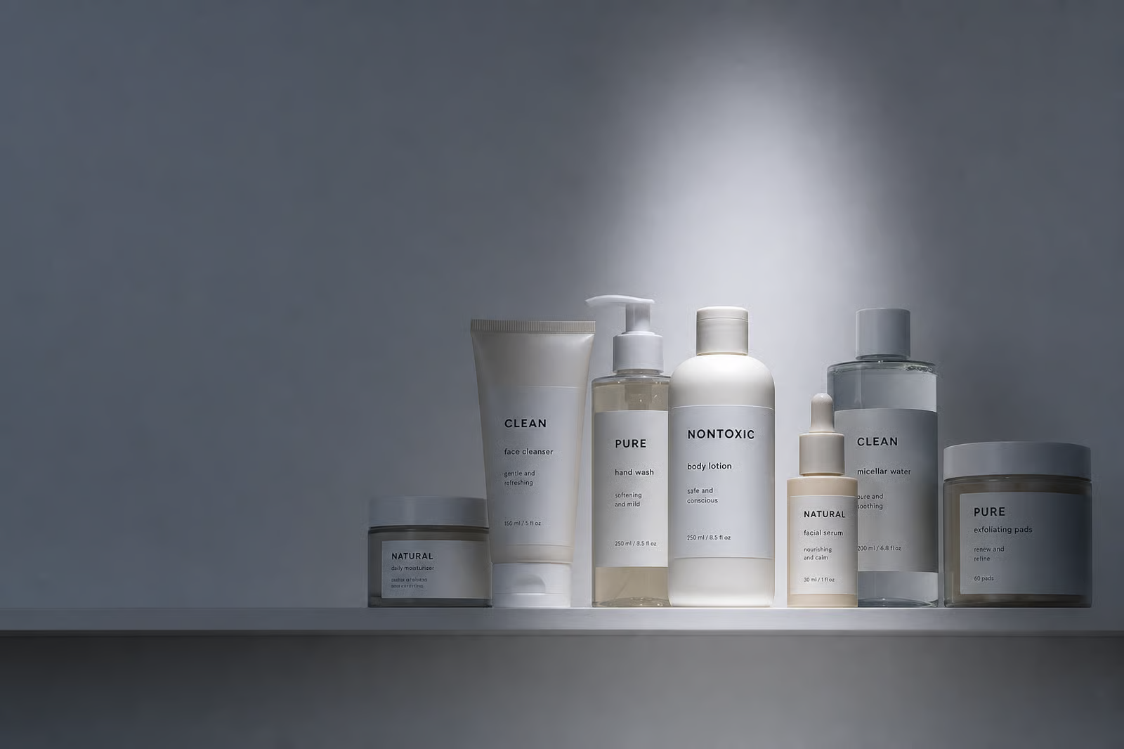 A shelf of minimalist beauty products labeled Clean, Pure, Nontoxic, and Natural